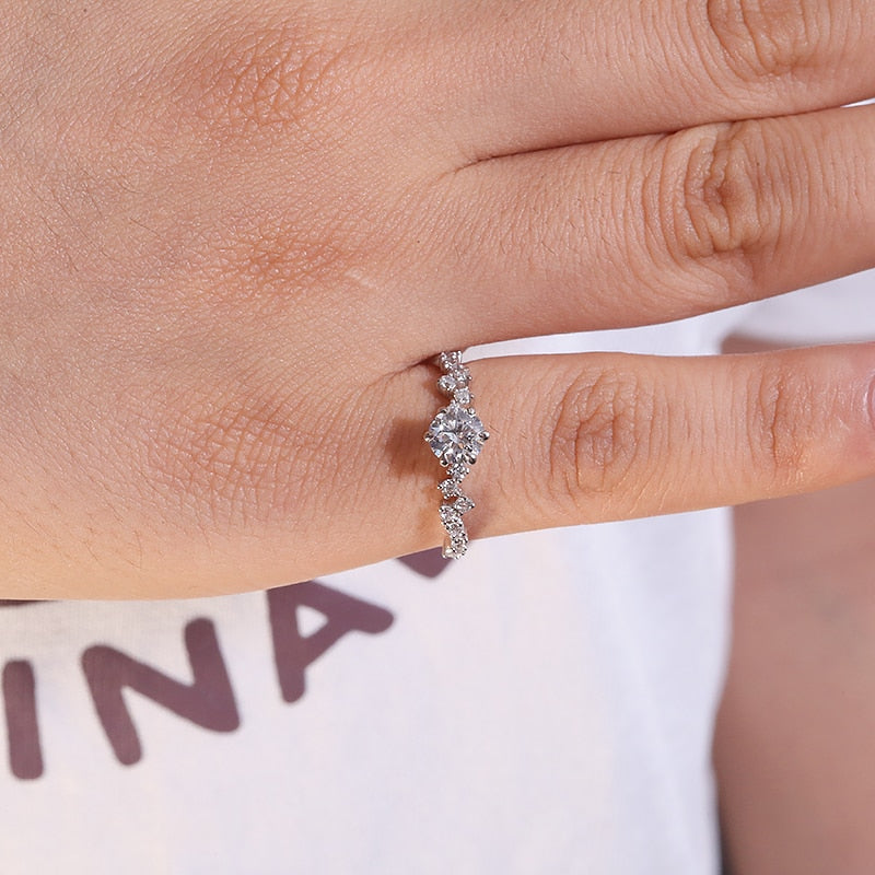 Woman's hand showcasing 1.0ct Round Cut Lab Diamond Ring on 14k White Gold.