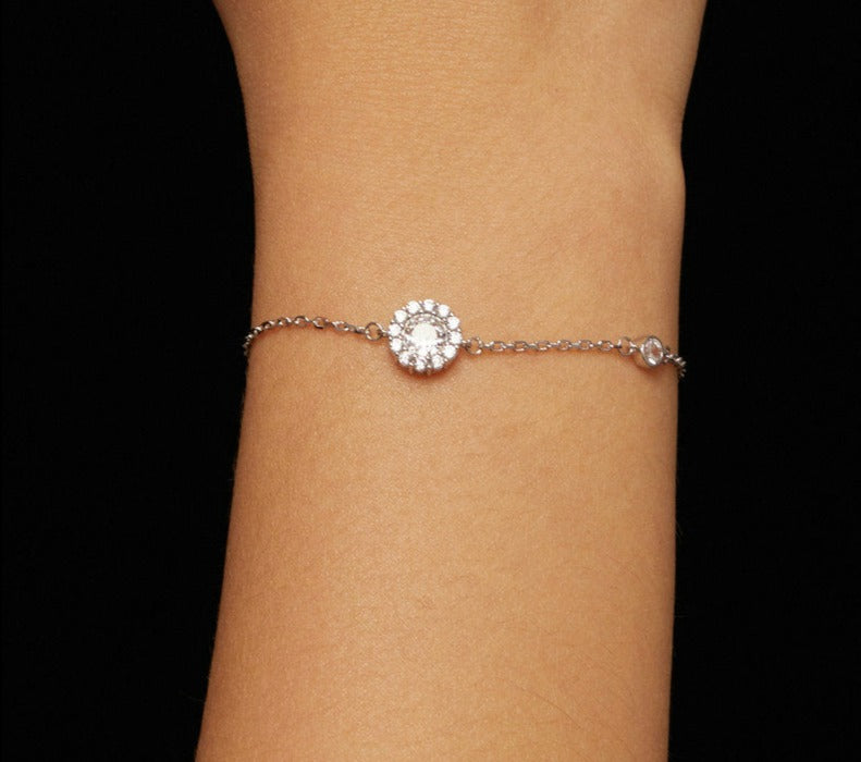 Image of a Tanisy Halo Adjustable Bracelet with a white gold chain and diamond accents.