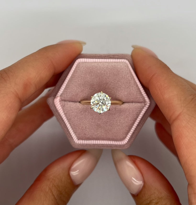  Woman's hand showcasing Tanisy Radiance 1.0ct Round Cut Lab Diamond Ring on 14k Gold.
