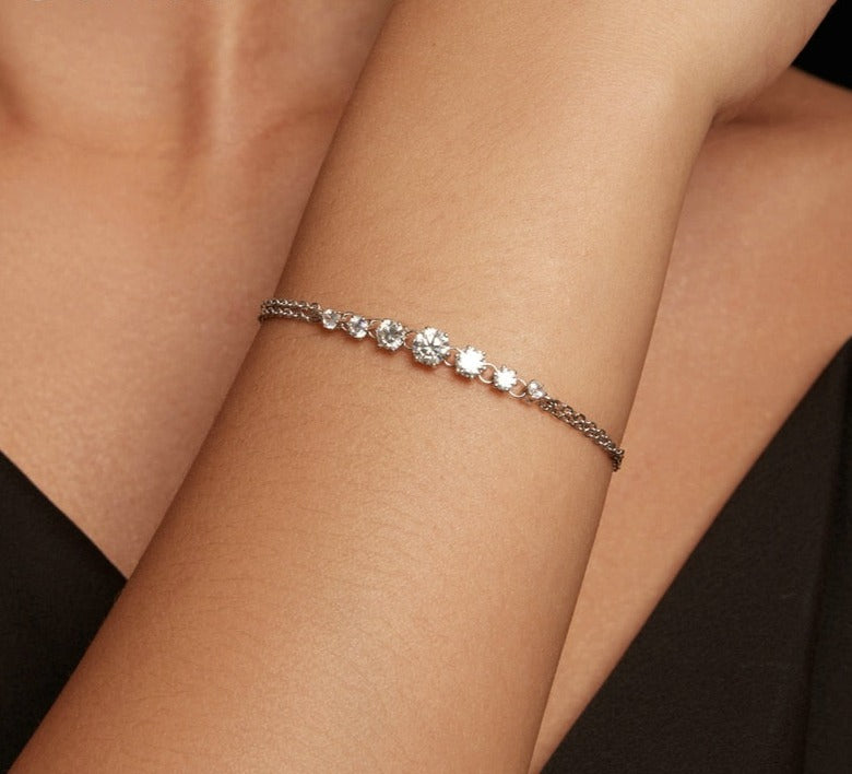 Elegant Tanisy Sparkling Moissanite Bracelet featuring diamond chain and heart charm.