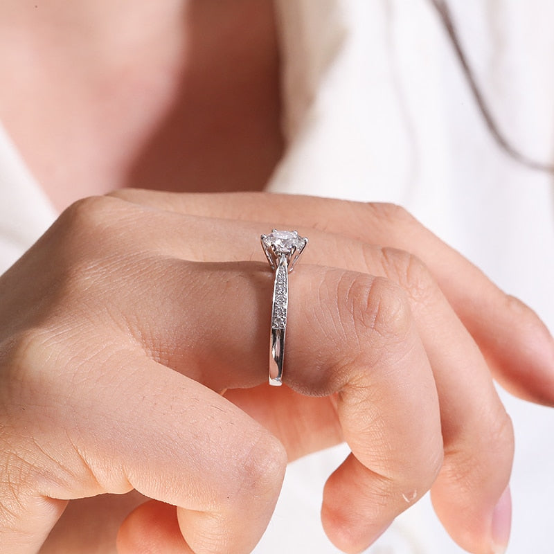 Woman's hand holding 1.017ct Lab Grown Diamond on 14k White Gold Ring.