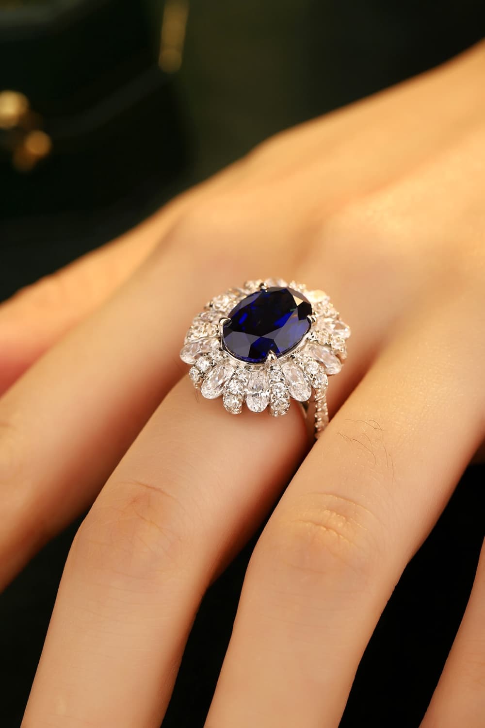 Woman showcasing Tanisy Radiance 5 Carat Lab-Grown Sapphire Flower Shape Ring.