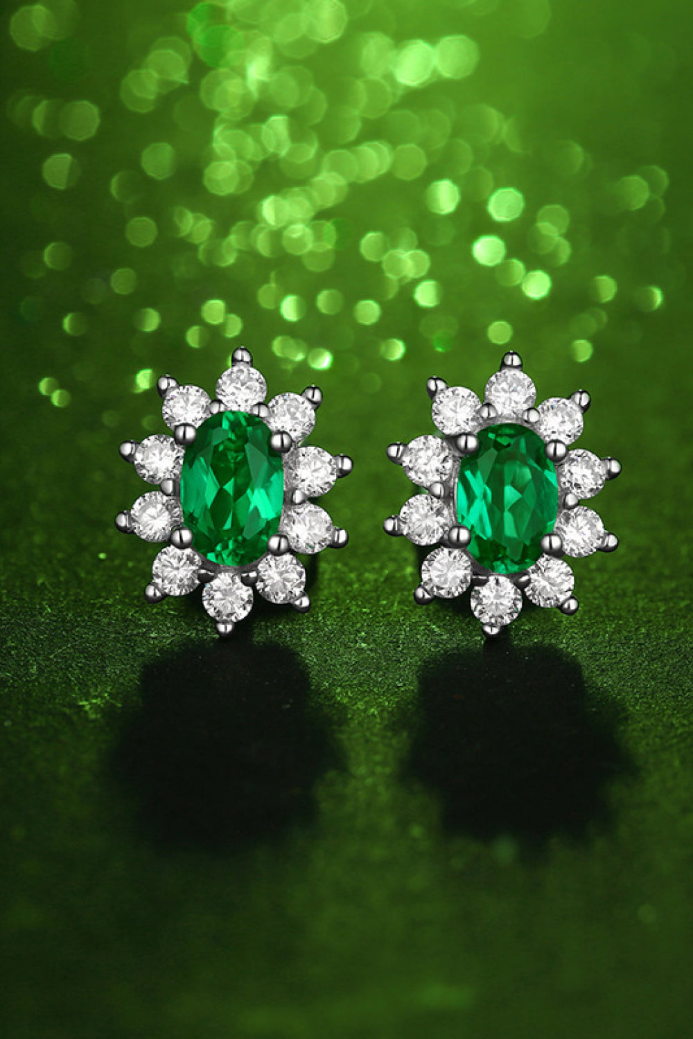 Lab grown 1ct emerald stud earrings with diamond accents.