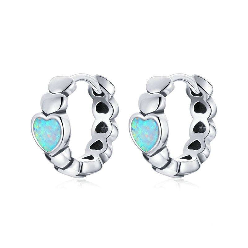 Heart-shaped opal hoop earrings crafted from 925 sterling silver.