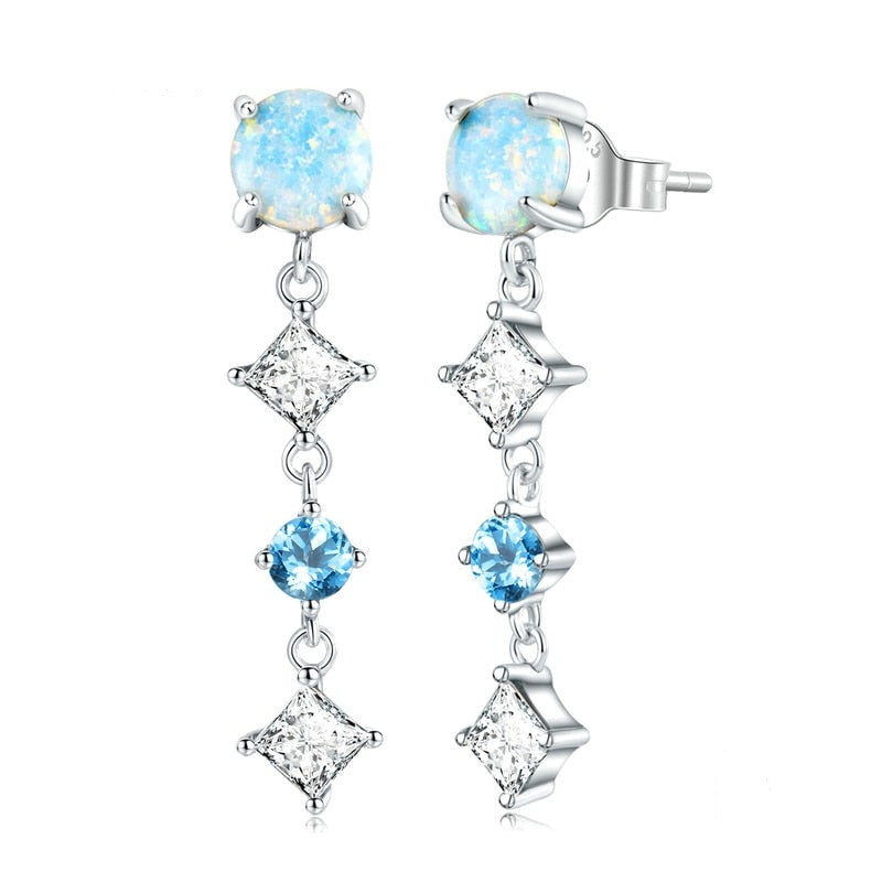Elegant earrings featuring opal and zirconium stones in a dangling design.