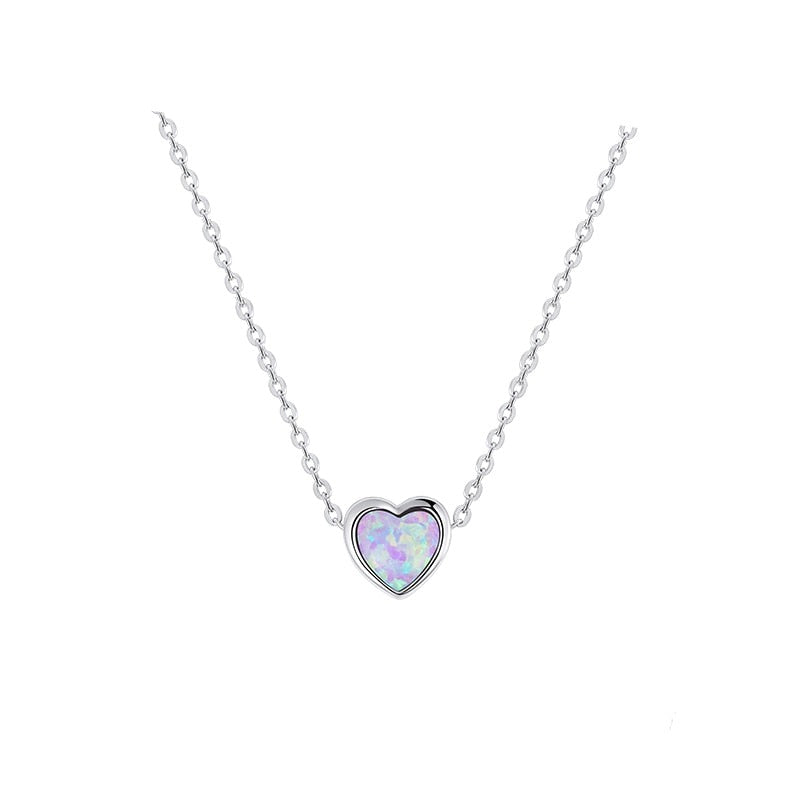 A heart-shaped necklace with a white opal stone